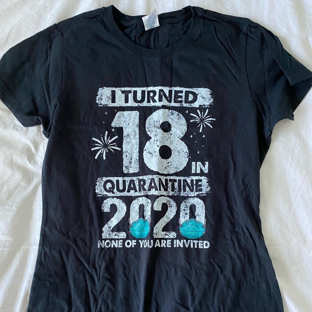 Black "I turned 18 during quarantine" t-shirt.